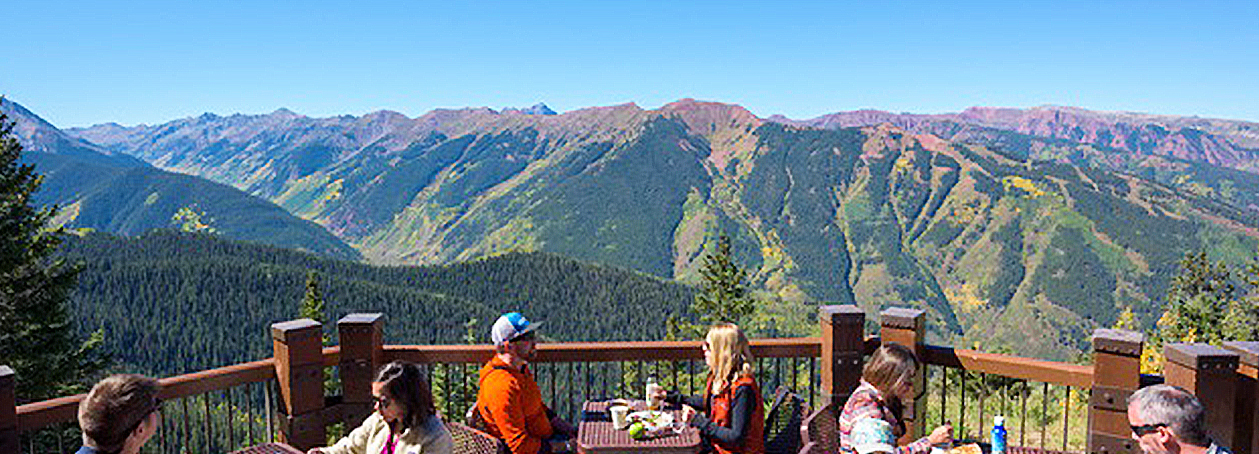 Happy hikers having lunch on the Sundeck on Aspen Mountain