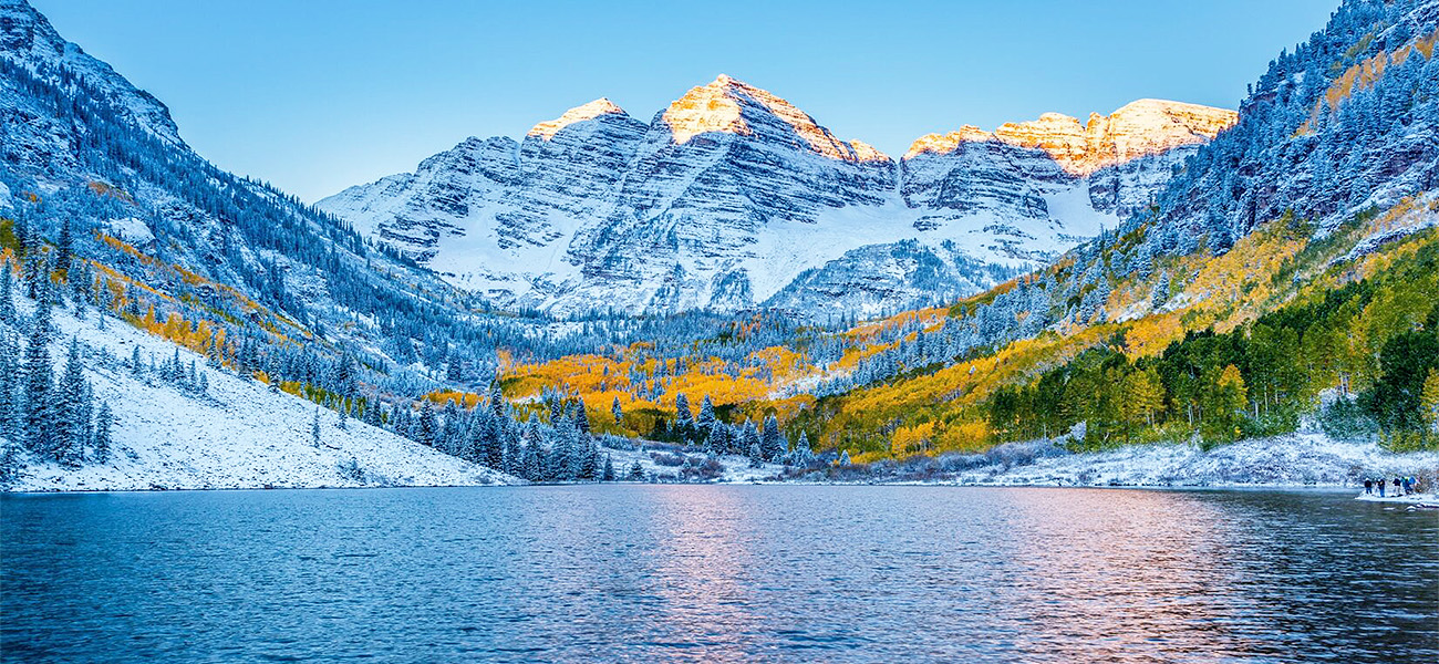 Maroon Bells covered in snow during late fall