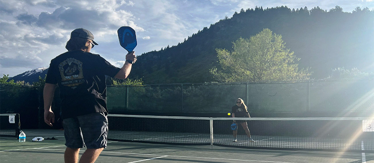 Man and Women playing Pickleball at Iselin Pickleball Courts in Aspen, Colorado