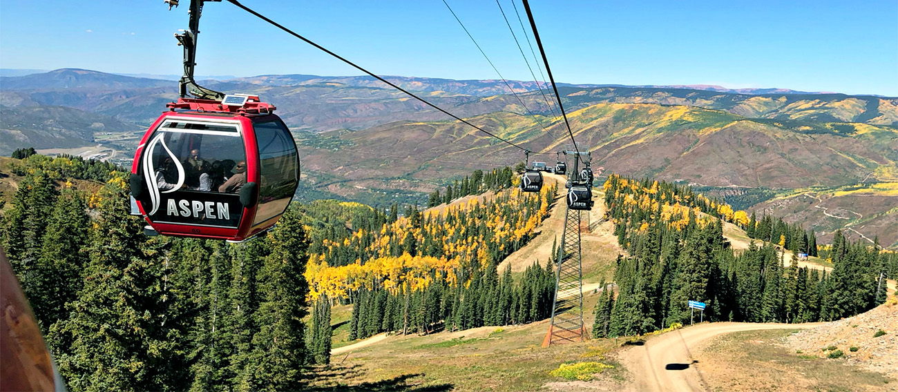 People taking Gondola Ride over Aspen Mountain in Aspen, Colorado