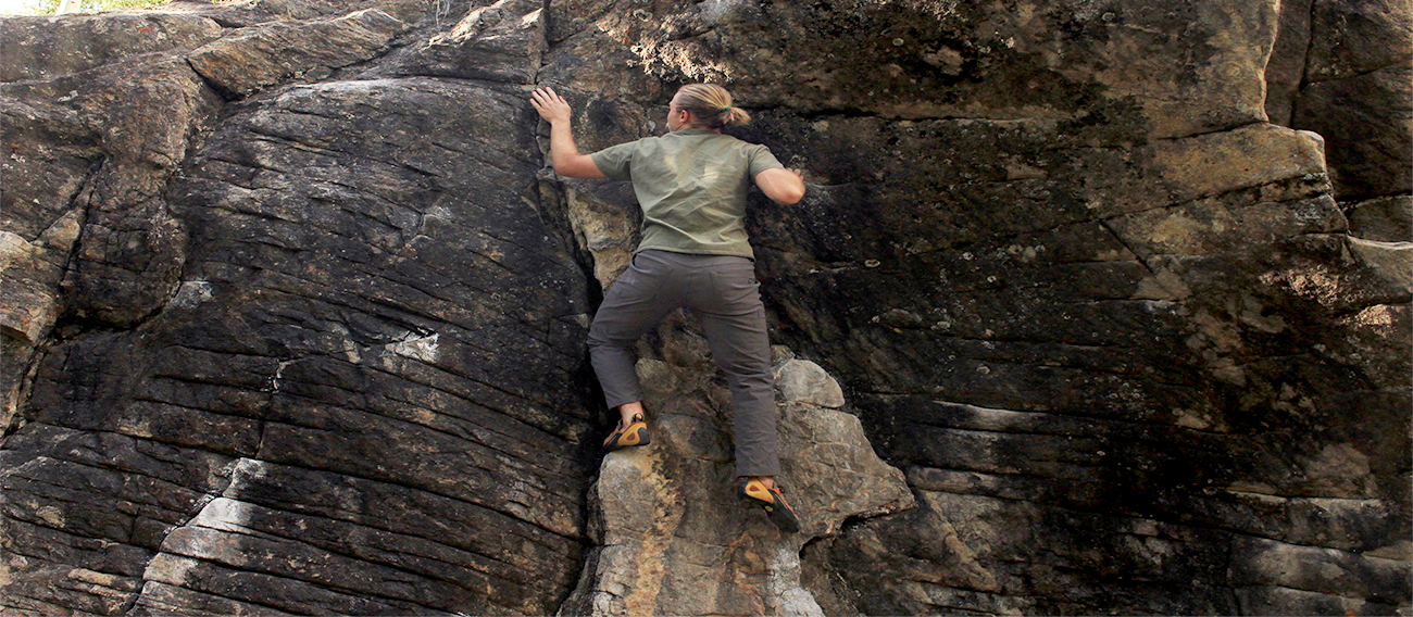 Man rock climbing up vein on cliff face in Independence Pass Aspen, Colorado